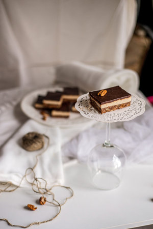 Very appetizing beautiful food photo of tasty chocolate authentic canadian dessert Nanaimo with nuts...