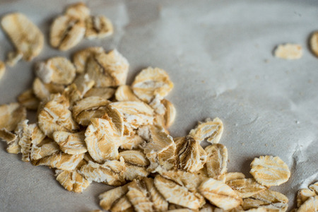 beautiful photo of some oats scattered on aged paperの写真素材