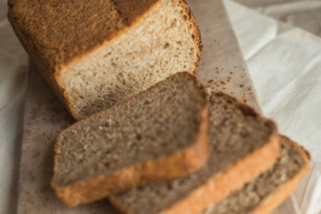 beautiful food photo of fresh homemade sourdough wheat form bread  served on the rustic background