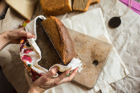beautiful food photo of fresh homemade sourdough wheat form bread  served on the rustic background
