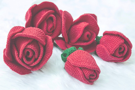 Rose knit with yarn handmade on soft focusの写真素材