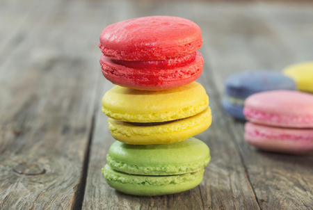 Macaroon colorful on the wooden floorの写真素材