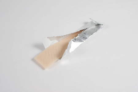 chewing gum is on the white background with paper.