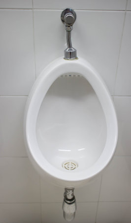 white urinals men in public toilets