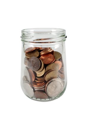Coins in Glass Jar on the White Backgroundの写真素材