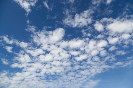 landscape beautiful cumulus clouds against a blue sky on a sunny dayの写真素材