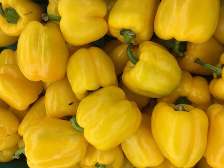 The yellow chili on shelf in the market.の写真素材