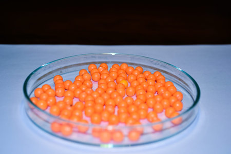 Orange balls in pans on white background