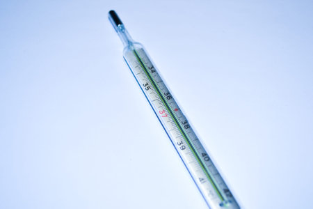 Old thermometer on white background