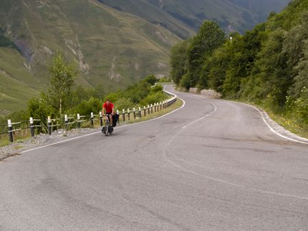 Mountain route in Georgia, man on the bicycles.の写真素材