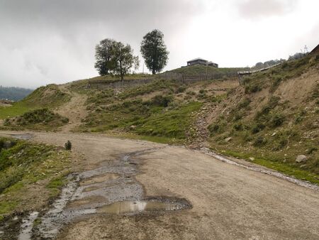 Empty wet mountain route, one cottage on the hill. Georgiaの写真素材