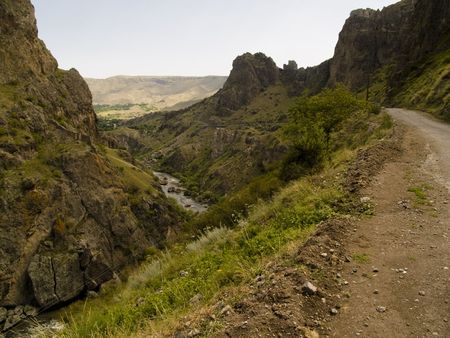 Narrow mountain path, River in valley. Summer day in Georgia. Caucasusの写真素材
