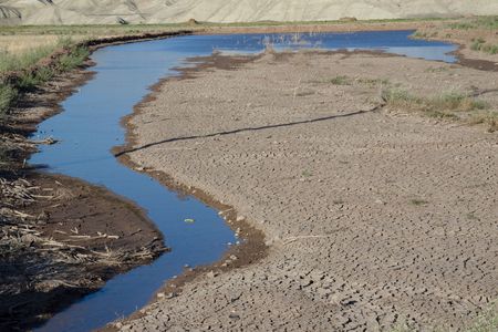 Dry ground small river on the desert - Iranの写真素材