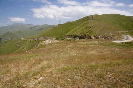Mountain scenery in Armenia, route green meadows and blue sky.の写真素材
