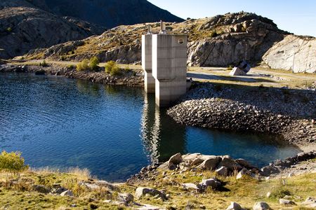Tower on blue lake in Pyrenees - Spain.の写真素材