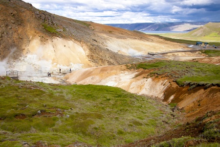Hot springs on geothermal area in background Kleifarvatn lake. Icelandの写真素材