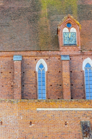 Red brick Wall of Assumption NMP and Holly Andrzej Cathedral in Frombork.の写真素材