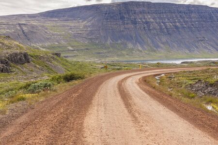 Gravel empty rural route to Dynjandi waterfall - Iceland, Westfjords  Summer day の写真素材