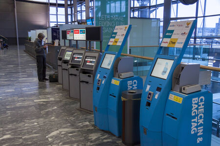 OSLO GARDERMOEN, NORWAY -  NOVEMBER 3:Check in machine at Oslo Gardermoen International Airport on november 3, 2014 in Oslo. The airport has biggest passenger flow in Norway.のeditorial素材