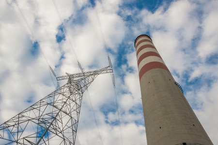 High voltage lines and chimney - coal power station. Europe.