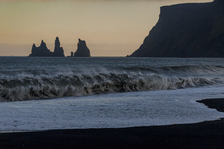 Reynisdrangar rock formations and the mount Reynisfjall. Black beach in Vik, southern Icelandの写真素材