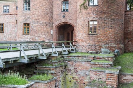 Old brick gate to fortification in Frombork - Poland.の写真素材