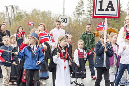 VERDAL, NORWAY - MAY 17, 2017: National day in Norway. Norwegians at traditional celebration and parade  on may 17, 2017 in Verdal. People on parde before school in Verdal. Constitution Day is the National Day of Norway.のeditorial素材