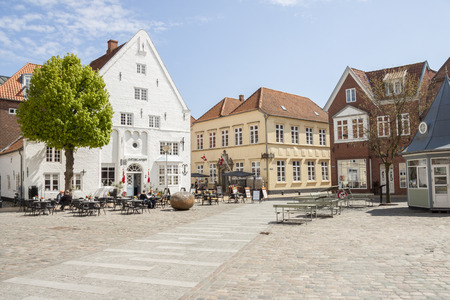 TONDER, DENMARK - MAY 7, 2017: People relaxing on sunny sunday in restaurant on main square of old town on may 7, 2017 in Tonder, Denmark.のeditorial素材