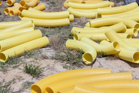Yellow drain pipe - construction site.の写真素材