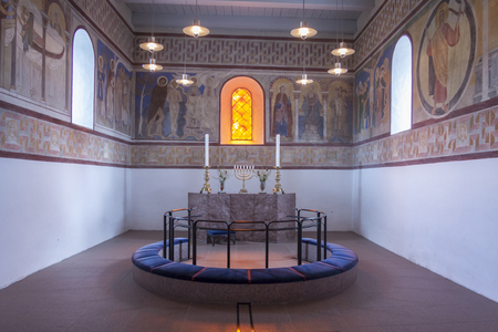JELLING, DENMARK - MAY 9, 2017: Interior of white church on the monument area which enjoys UNESCO World Heritage patronage on may 9, 2017 in Jelling, Denmark.のeditorial素材