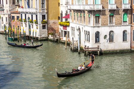 VENICE, ITALY -  MAY 2, 2019: Tourists visiting the old city of Venice on May 2,2019 in Venice in Italy. View on Grand Canal in Venice.のeditorial素材