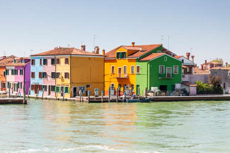 Burano, ITALY -  MAY 2, 2019: Tourist on street of old Colorful city of Burano on May 2,2019 in Burano island in Italy. View on Colorful houses.のeditorial素材