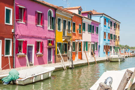 Burano, ITALY -  MAY 2, 2019: Tourist on street of old Colorful city of Burano on May 2,2019 in Burano island in Italy. View on Colorful houses.のeditorial素材