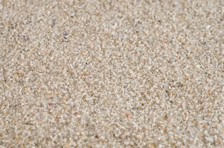 Sand texture background in macro, big closeup with deatals, focus in the middle of the pictureの写真素材