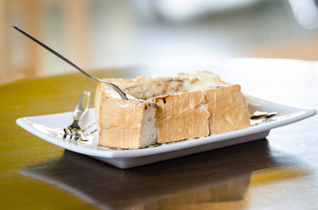 Bread topped with milk palatable coffee shop in delicious.の写真素材