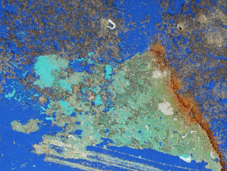 Grunge blue paint on rusty metal surface as a background textureの写真素材