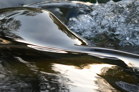 Close-up of the water surface with ripples and ripplesの写真素材