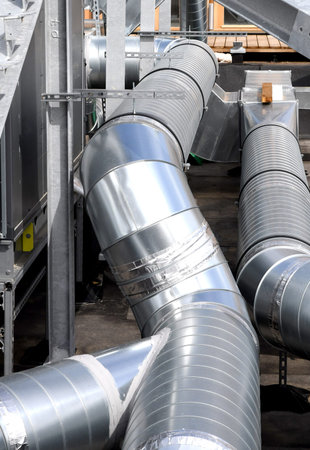 Industrial Steel pipelines and valves in a factory, closeup of photo