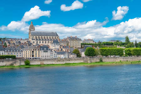 Blois in France, panorama of the city, with the Saint-Nicolas church and the river Loire under an old bridgeの写真素材