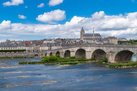 Blois in France, panorama of the city, with the Saint-Nicolas church and the river Loire under an old bridgeの写真素材
