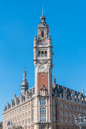 Lille, old facades in the center, the belfry of the Chambre de Commerce in backgroundの写真素材