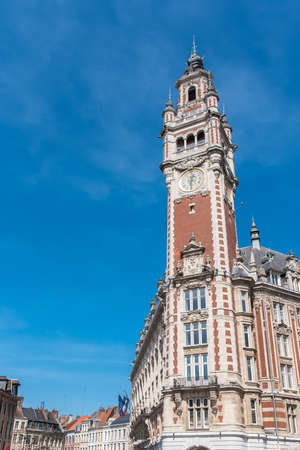 Lille, old facades in the center, the belfry of the Chambre de Commerce in backgroundの写真素材