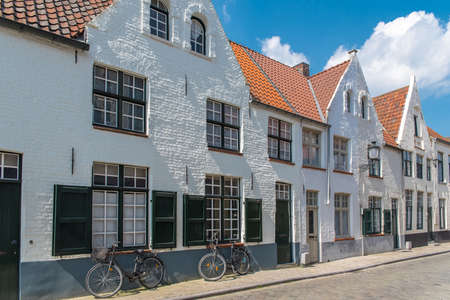 Bruges in Belgium, beautiful typical houses on the canalの写真素材