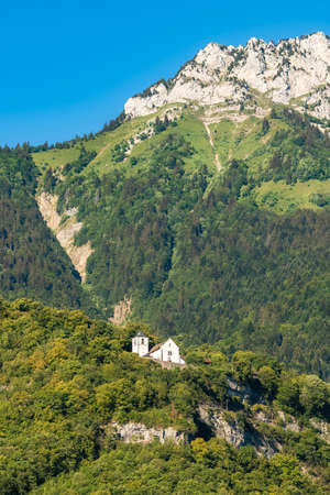 Annecy in France, the Ermitage of Saint-Germain, Talloires, chapel above the lake in summerの写真素材