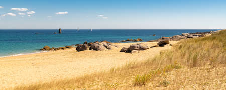 Yeu island in France, beautiful landscape, beach with a lighthouse in backgroundの写真素材