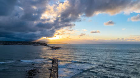Saint-Jean-de-Luz in France, panorama of the bay and the pier, beautiful light at sunsetの写真素材