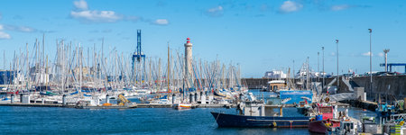SÃ¨te in France, fisherboat at the quay, typical colorful facades in the harborのeditorial素材