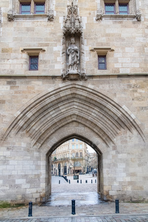Bordeaux in France, the Cailhau gate in the center, typical street and monumentのeditorial素材