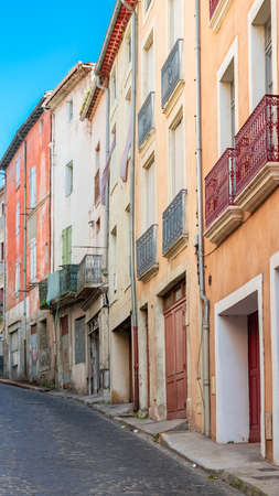 BÃ©ziers in France, colorful houses, typical street in the old centerの写真素材