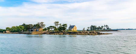 Boedic island, with the chapel, in the Morbihan gulf,  on the coast, on sunsetの写真素材
